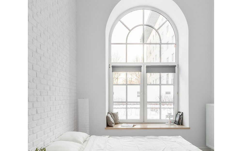 arched window above bed